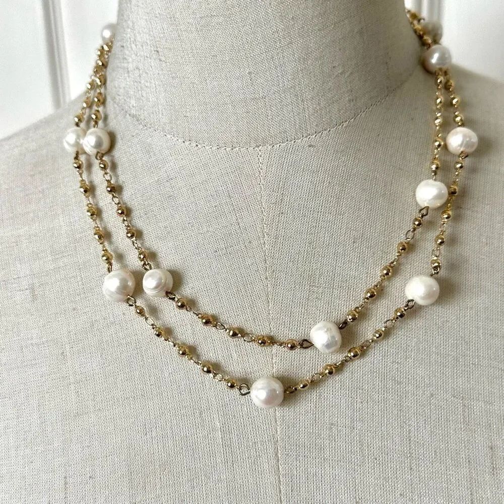 Gold tone and pearl long necklace